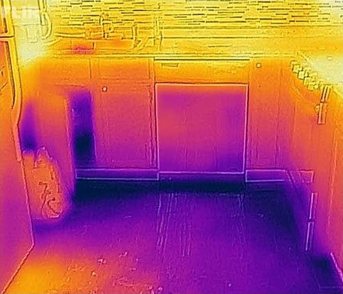 Thermal image of water damage to kitchen floor and cabinets