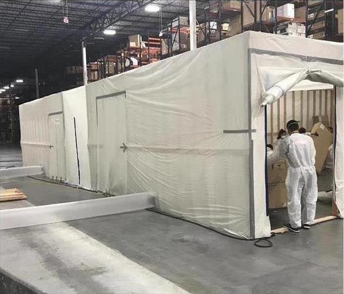 onsite containment setup for mold remediation in large commercial warehouse
